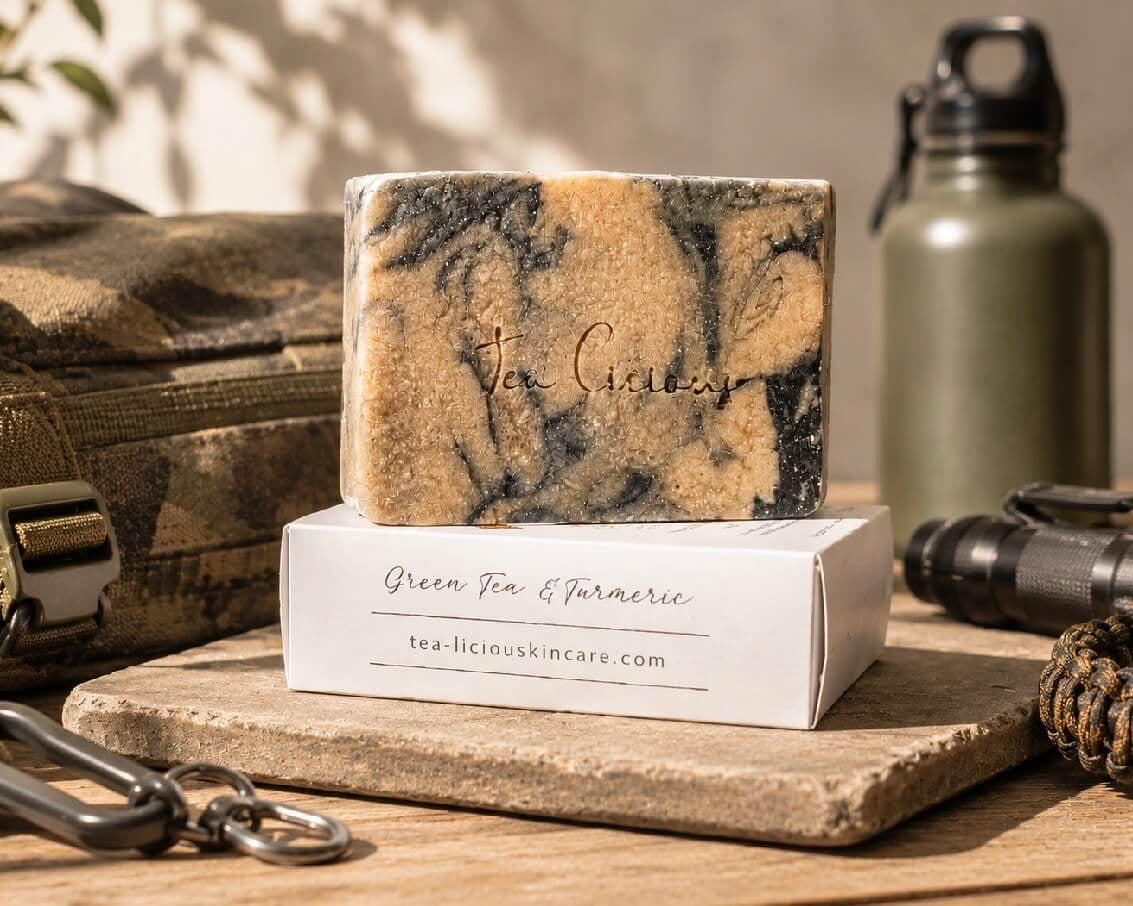 Tea -licious Green Tea and Turmeric soap bar with men’s grooming gear in warm natural sunlight.