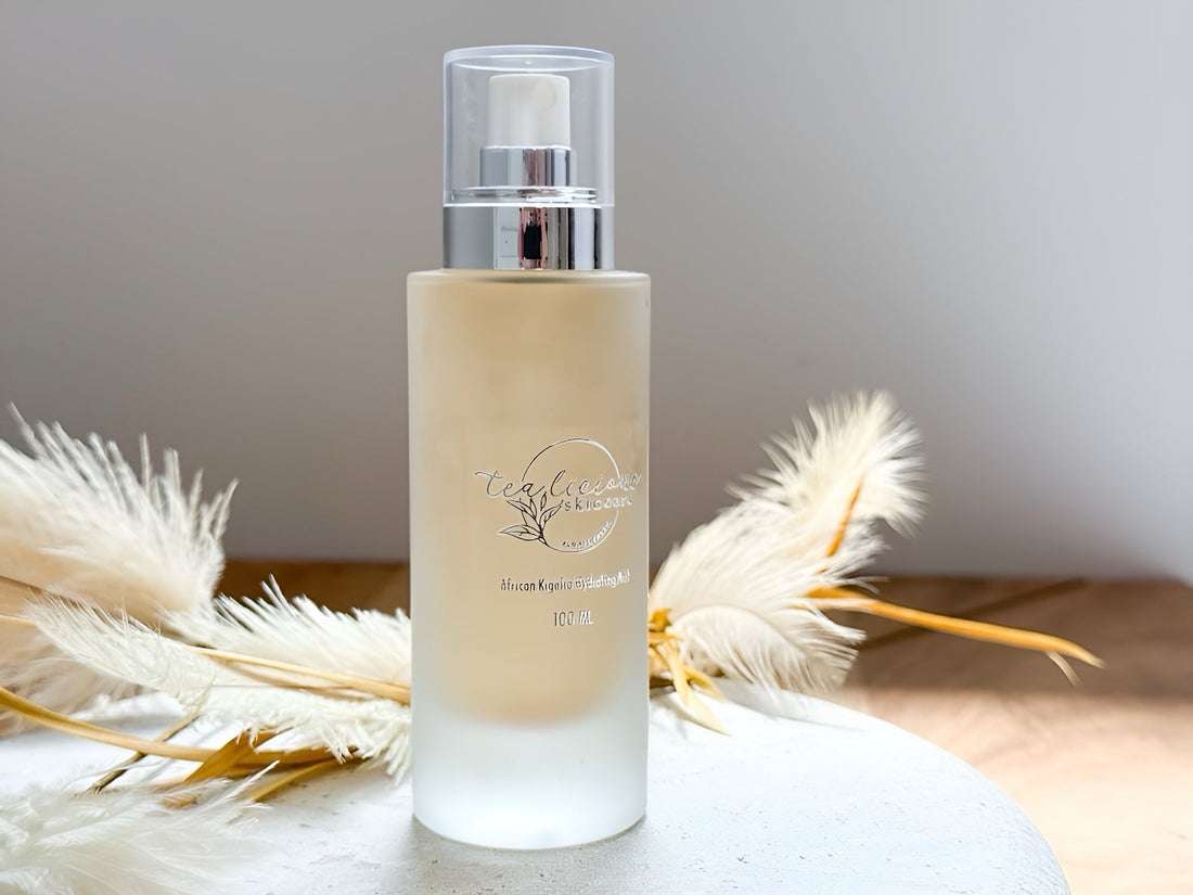Tea-licious Skincare African Kigelia Balancing Milk in frosted glass pump bottle — lightweight botanical facial moisturizer