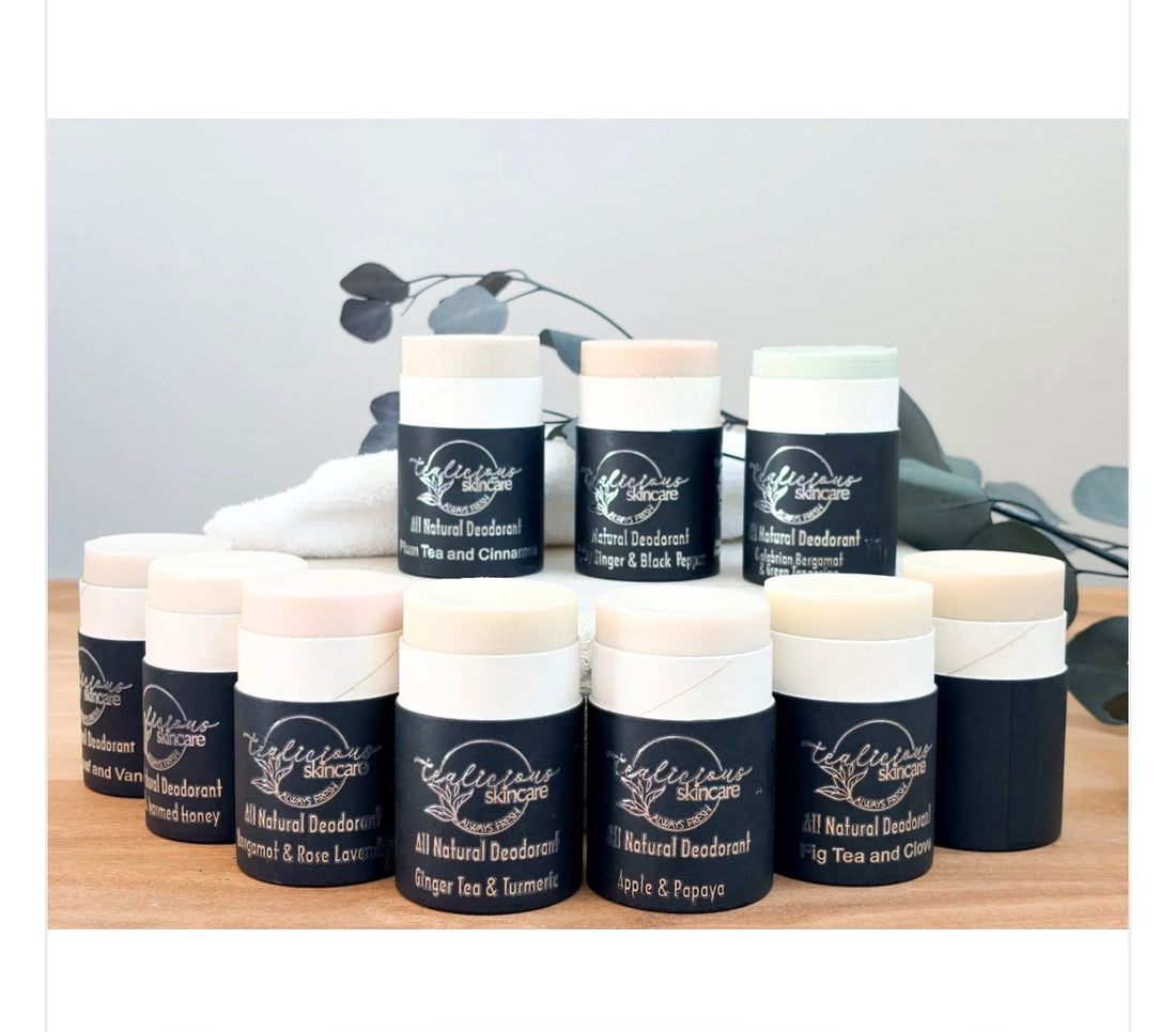 Tea-infused natural deodorant without baking soda lineup in eco-friendly packaging on wood surface