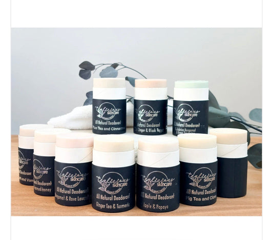 Tea-infused natural deodorant without baking soda lineup in eco-friendly packaging on wood surface