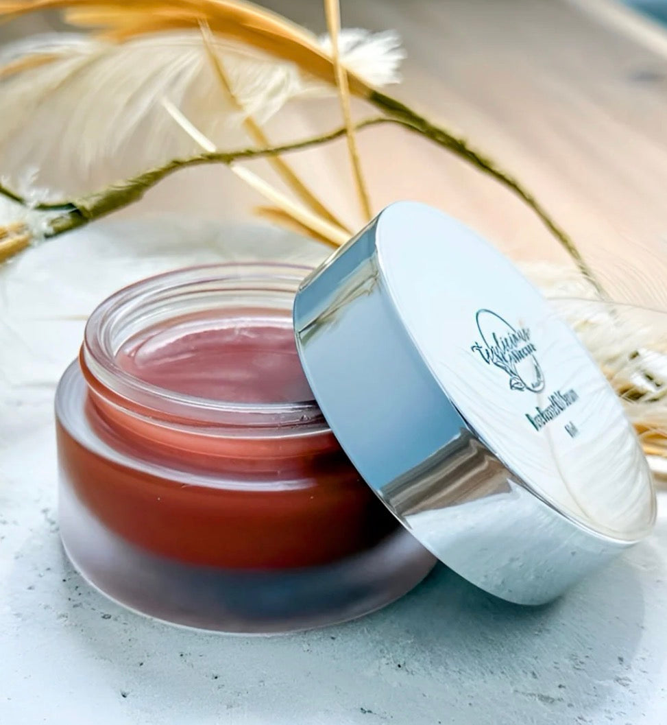 Tea-infused bio-active face balm in glass jar