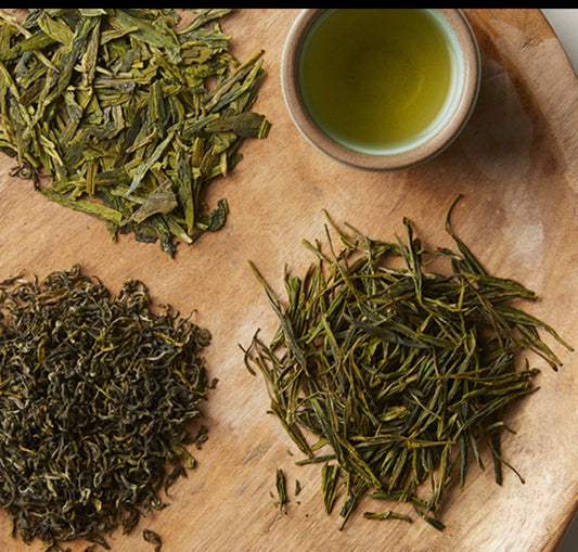 Tea leaves and brewed tea used in tea-infused botanical skincare formulations.