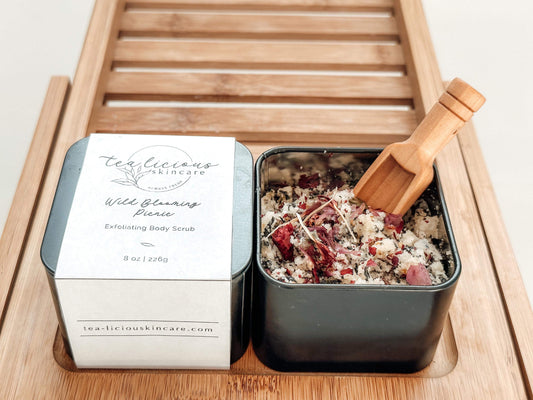 Black tin showing botanical all natural sugar scrub for body. 
