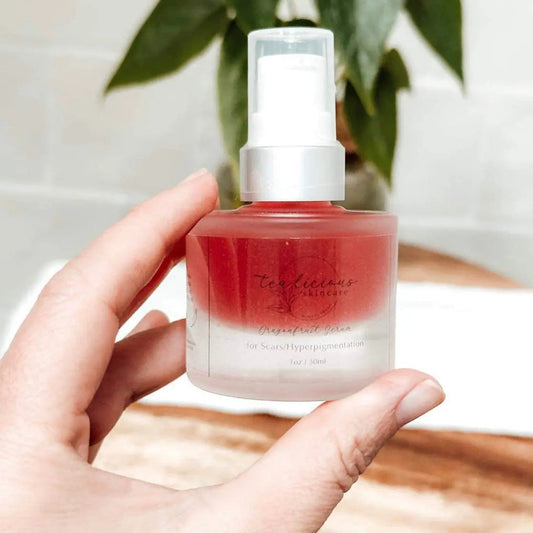 Tea-Licious Dragonfruit Serum in gradient red ombre glass bottle with white pump – targeted for scars and hyperpigmentation, cruelty-free and handcrafted.