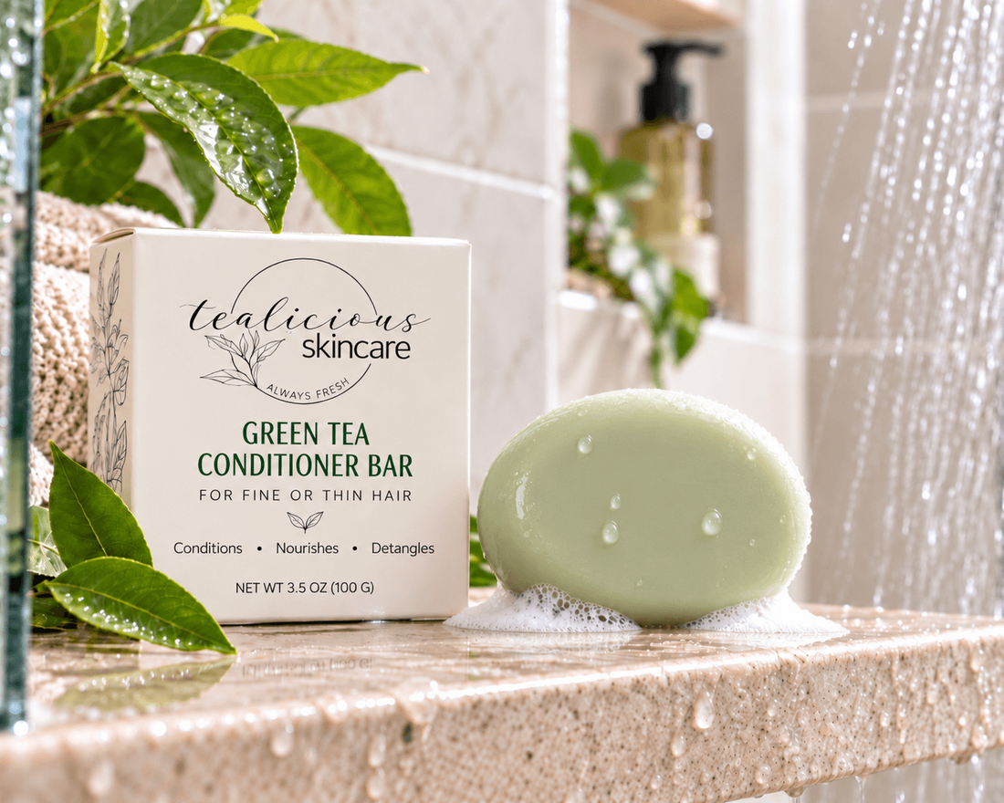 Tea-Licious Green Tea Conditioner Bar for fine or thin hair beside its box in a bright shower setting.
