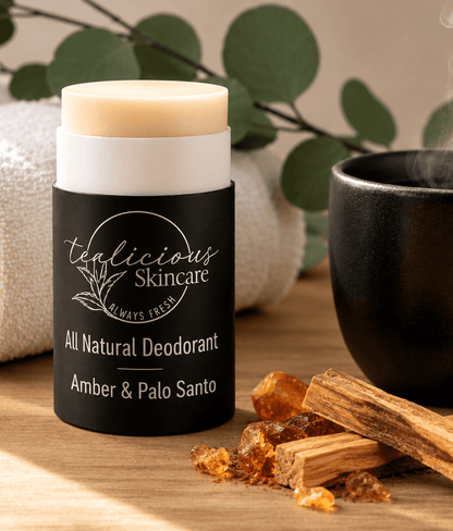 Tea-Licious Amber & Palo Santo baking soda-free deodorant styled with Palo Santo wood and warm amber accents.