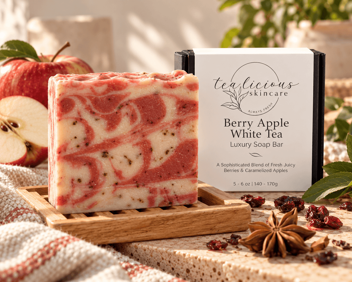 Berry Apple White Tea luxury soap bar with pink and cream swirls, displayed beside its Tea-Licious Skincare box with fresh apple and warm spices.
