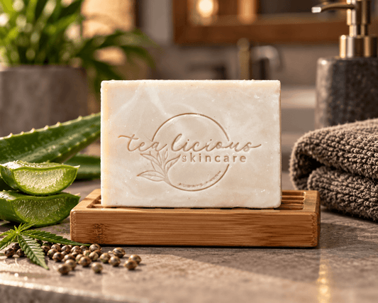 Tea-Licious Hemp Tea & Aloe Vera Men’s Soap Bar on a bamboo soap dish in a warm bathroom setting.
