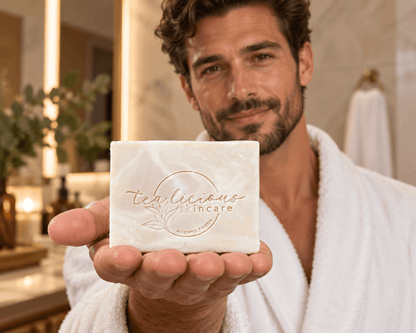Man holding Tea-Licious Hemp Tea & Aloe Vera Men’s Soap toward the camera in his open palm.