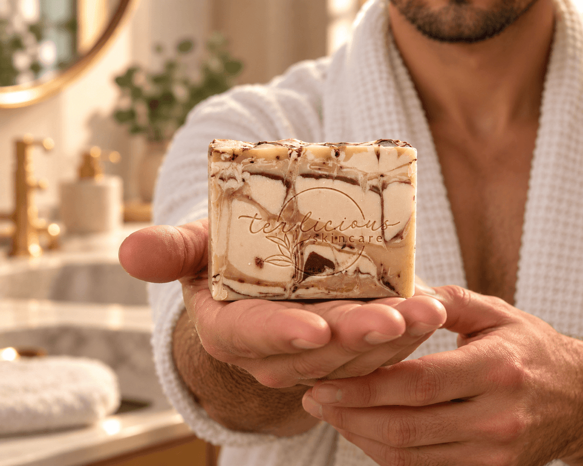 Man presenting Rooibos, Amber & Patchouli handcrafted tea soap in his open palm.