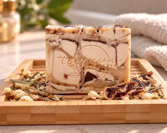 Tea-Licious Rooibos, Amber & Patchouli handcrafted soap with real tea leaves on a bamboo tray.