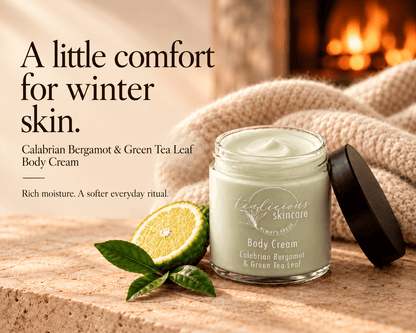 Calabrian Bergamot & Green Tea Leaf Body Cream beside bergamot and a knitted blanket, with the words “A little comfort for winter skin.”