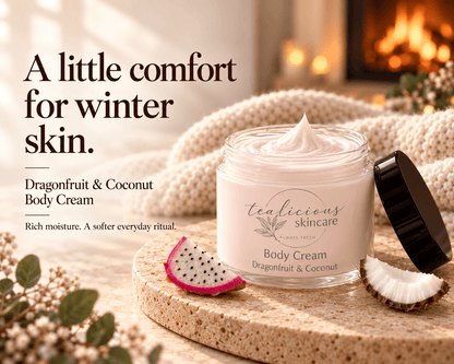 Tea-licious Dragonfruit & Coconut Body Cream beside a knit blanket and glowing fireplace, with the message “A little comfort for winter skin.”