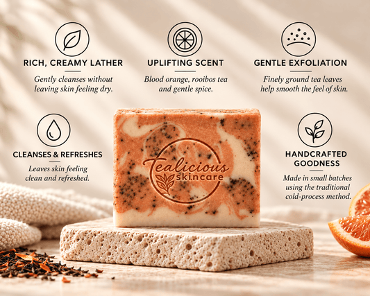 Tea-Licious Mulled Orange Cider Tea Soap on a stone tray, surrounded by five benefits highlighting creamy lather, citrus scent, gentle exfoliation, refreshing cleansing and handcrafted quality.