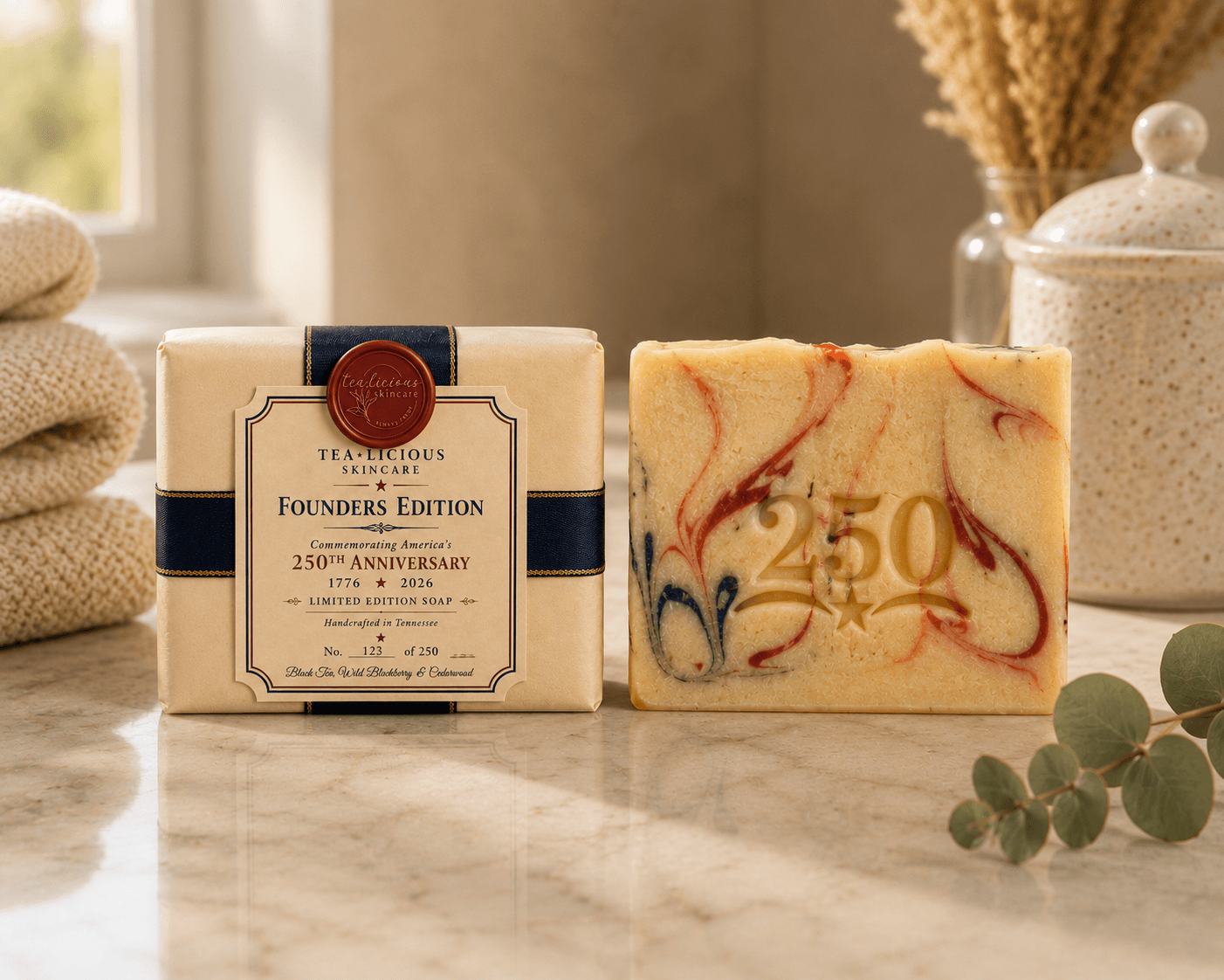 Limited-edition Tea-Licious Skincare 250th Anniversary soap and commemorative packaging featuring navy ribbon, wax seal, and numbered collector label.