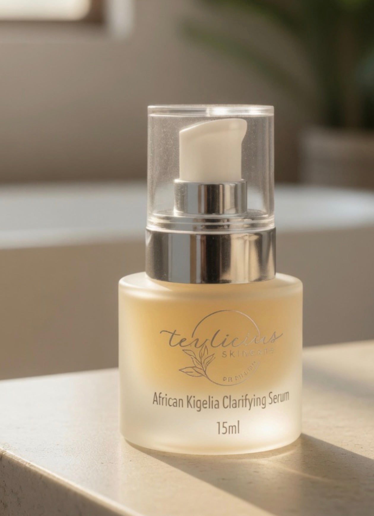 Close-up of Tea-licious African Kigelia Clarifying Serum on vanity in warm natural morning light