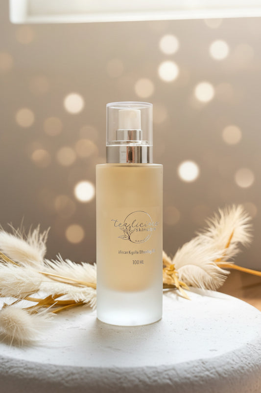 Tea-licious African Kigelia Hydrating Mist with soft botanicals in warm luxury skincare setting
