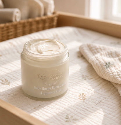 Tea-Licious Baby Happy Bums Cream fragrance free on quilted mat with soft natural morning light.