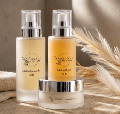 Tea-licious Baobab Tea cleanser, hydrating mist and moisturizer displayed in warm natural light