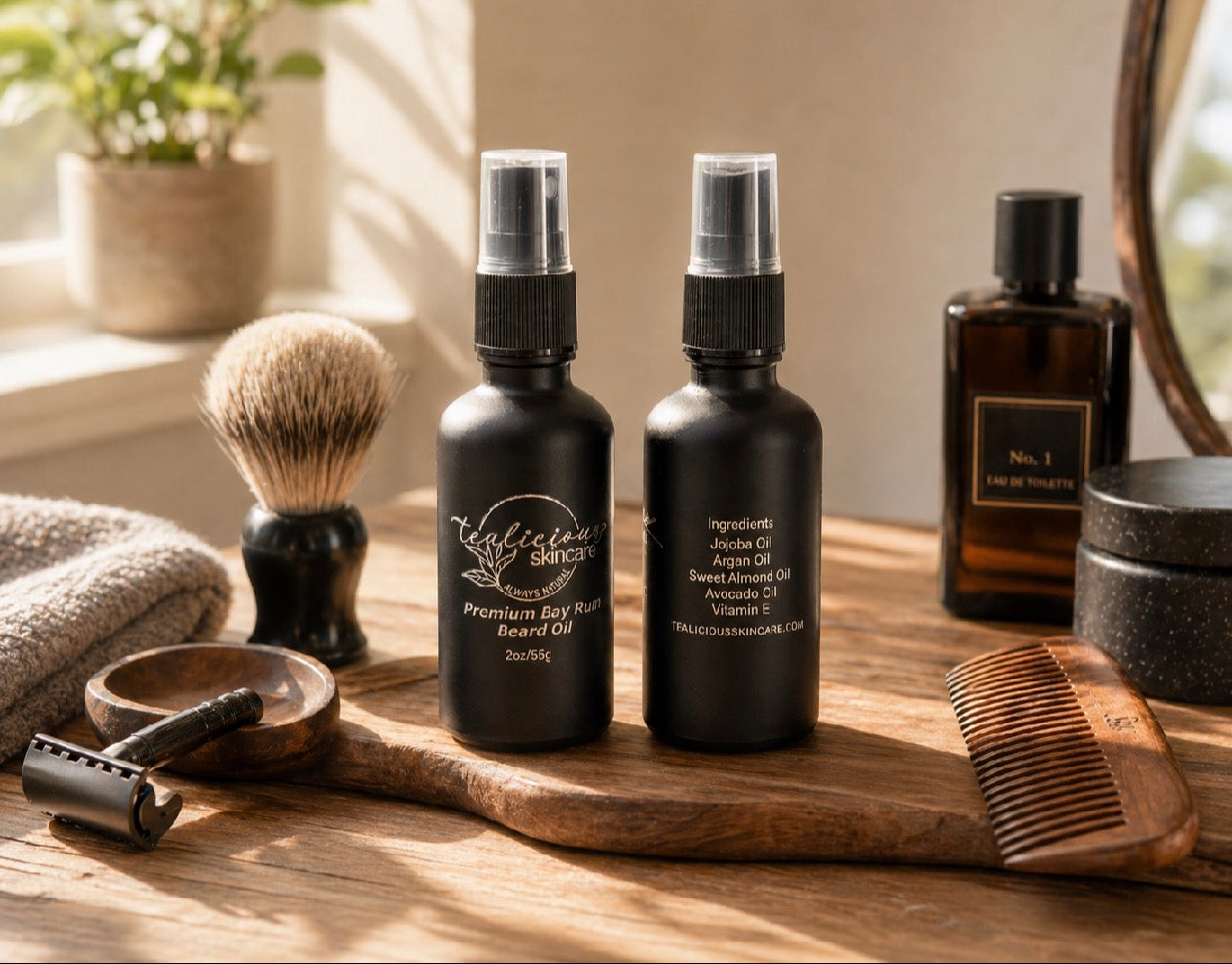 Front and back views of Tea-Licious Skincare Premium Bay Rum Beard Oil displayed on a wooden grooming tray with shaving brush, razor, comb, and vintage barbershop accessories in warm natural light.