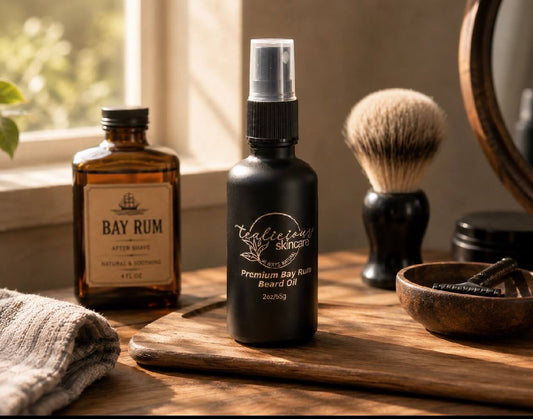Tea-Licious Skincare Premium Bay Rum Beard Oil displayed on a wooden grooming tray beside a traditional shaving brush and vintage bay rum bottle, illuminated by warm natural window light in a classic barbershop-inspired setting.