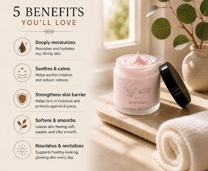 A jar of pink body cream with its black lid leaning beside it on a stone tray, set in a softly lit room with a window, rolled towel, and potted plant. Text on the left lists five benefits of the body cream.