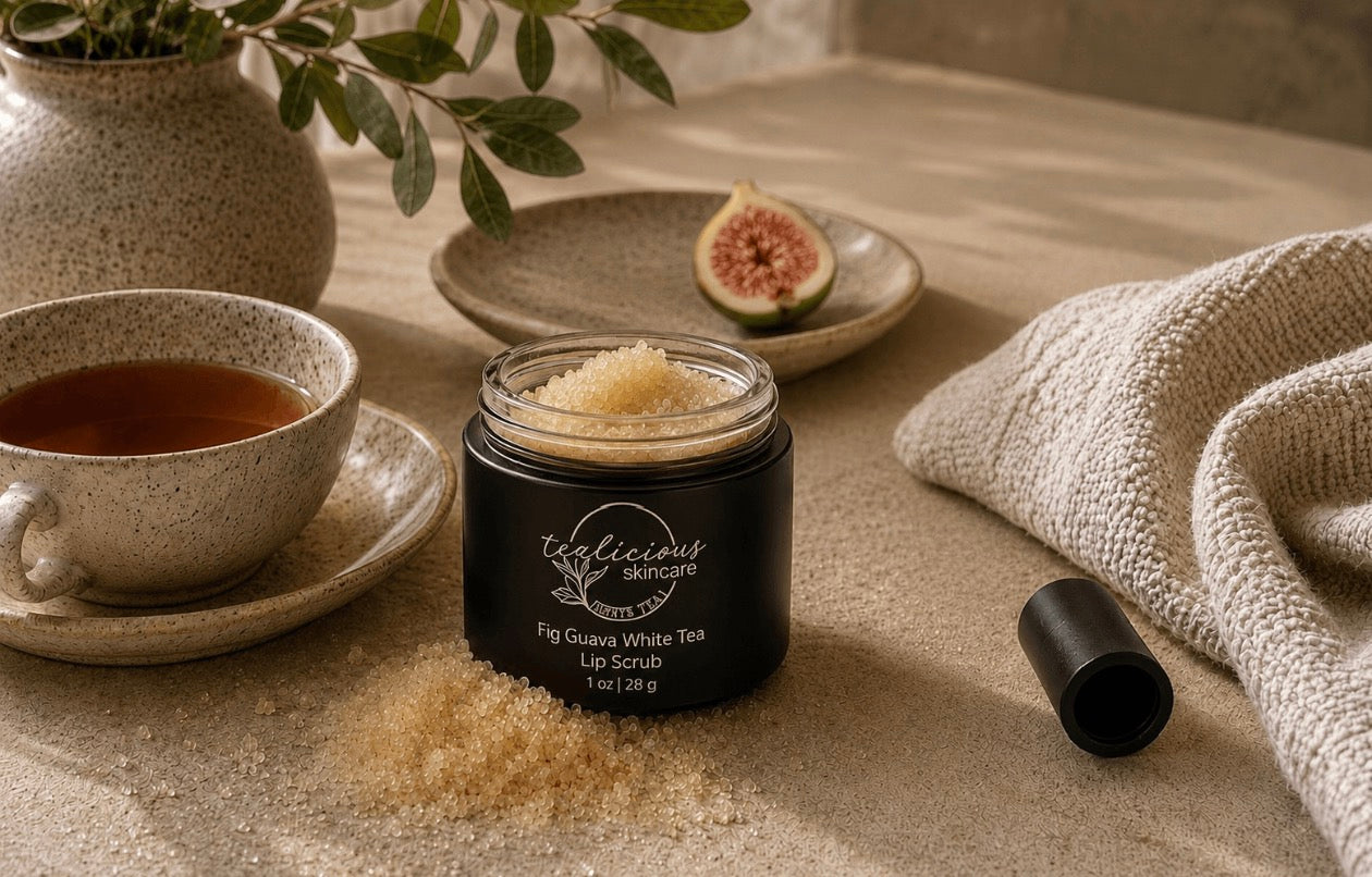 Tea-licious Fig Guava White Tea lip scrub with sugar texture in warm spa setting with soft light