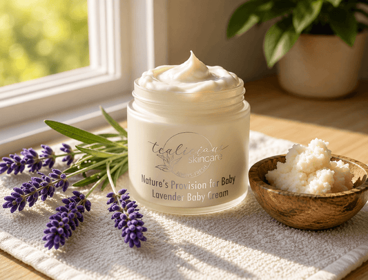 Tea-Licious lavender baby cream with lavender sprigs and botanical butters in warm natural light.