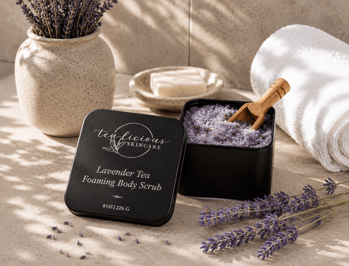 Tea-licious Lavender Tea Foaming Body Scrub in elegant bathroom with lavender and sugar crystals.
