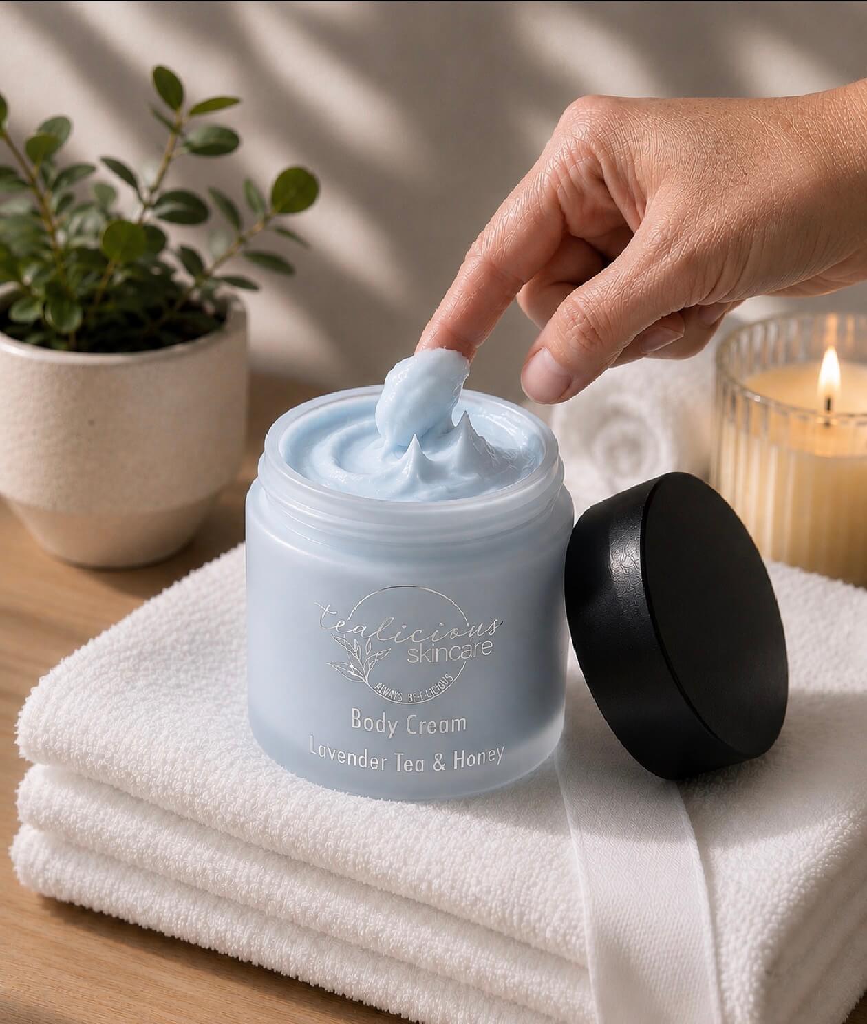 Tea-licious Lavender Tea & Honey body cream with whipped texture in warm spa-inspired setting.