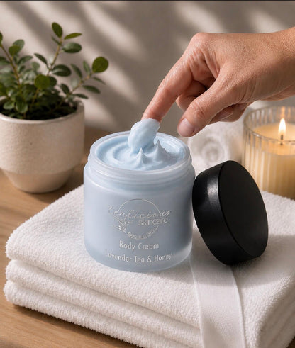 Tea-licious Lavender Tea & Honey body cream with whipped texture in warm spa-inspired setting.