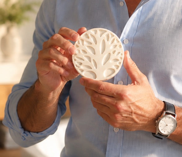 Man holding a Tea-Licious Skincare men’s solid lotion bar, showcasing a waterless black tea infused moisturizer designed to help relieve dry skin and support lasting hydration.
