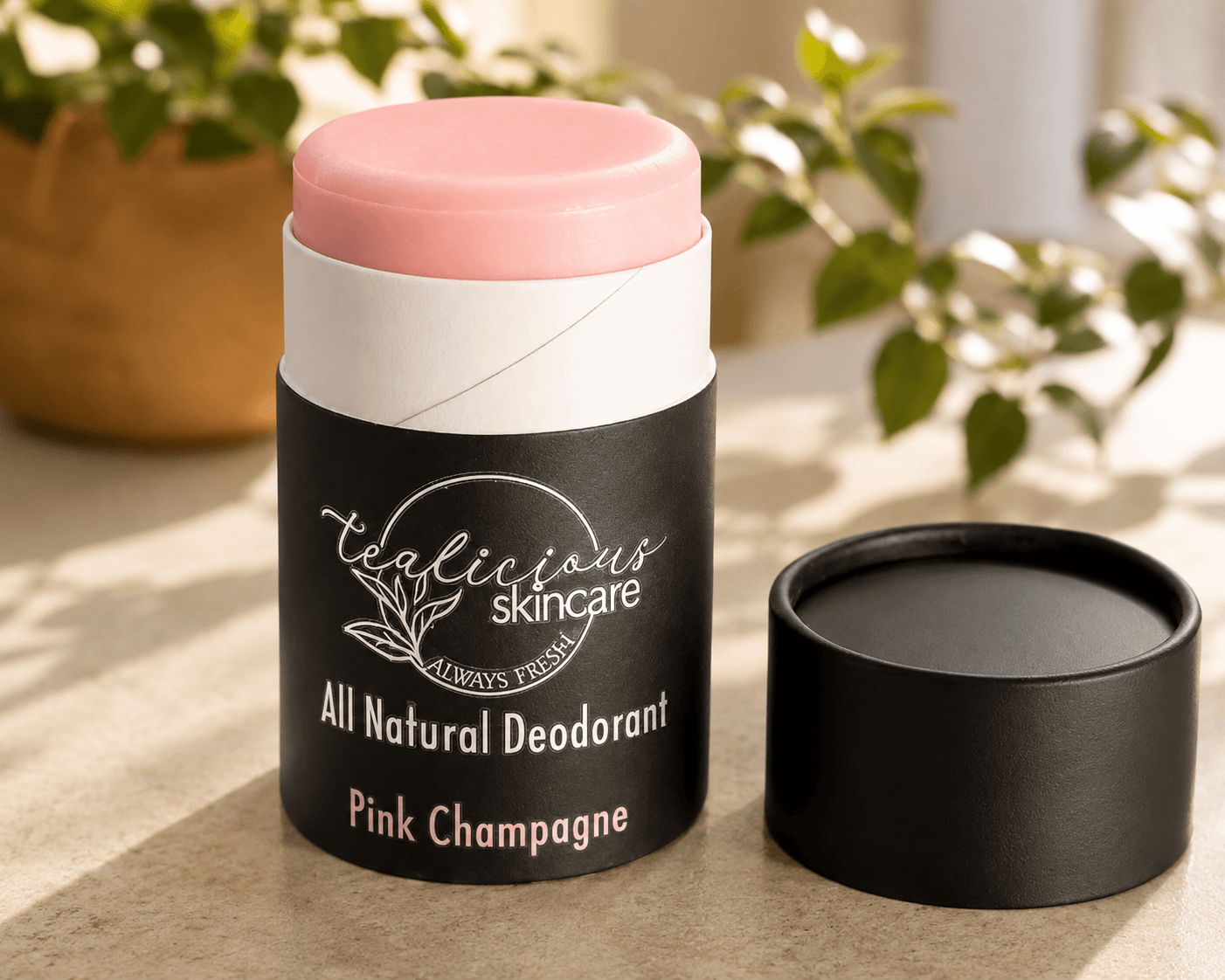 Tea-licious Skincare Pink Champagne baking soda free deodorant in a minimalist, warm morning light setting.