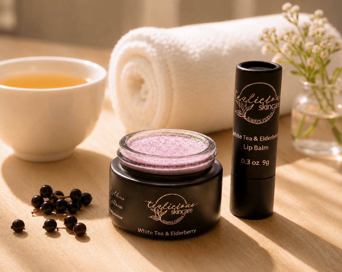 Tea-licious White Tea Elderberry lip scrub and lip balm in warm elegant bathroom morning sunlight