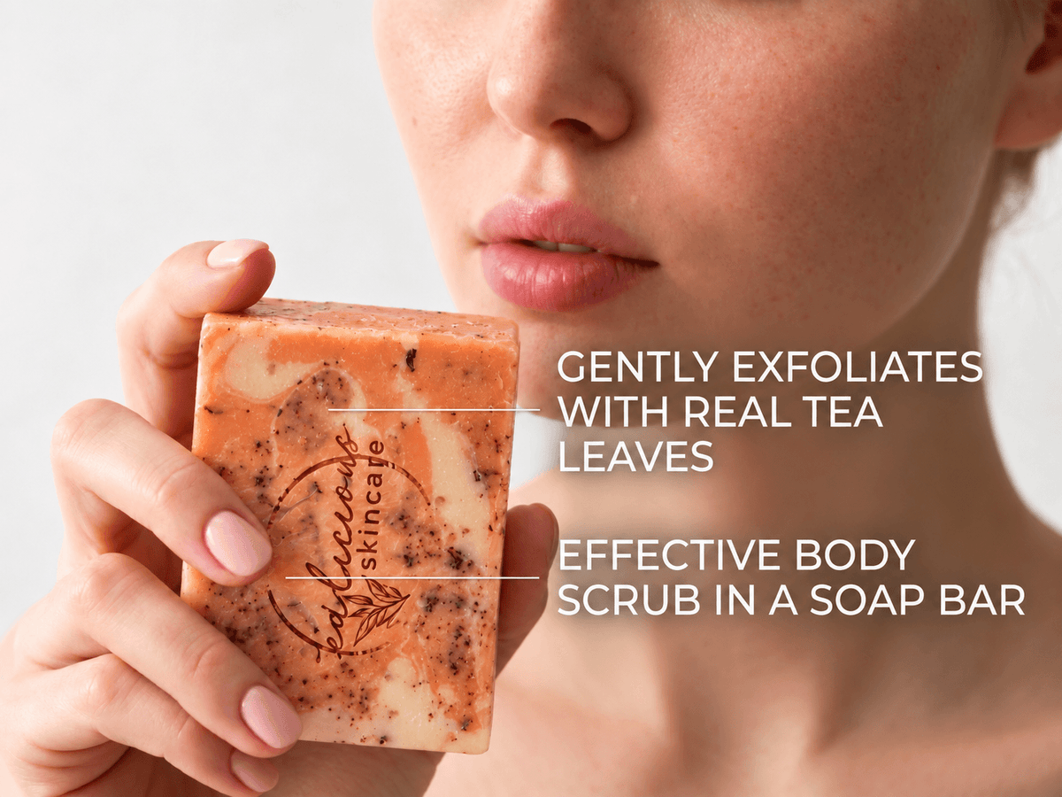 Woman holding an exfoliating orange soap bar infused with real botanical tea leaves, highlighting benefits for gentle exfoliation and effective body scrub use.